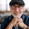 Senior man in denim shirt posing