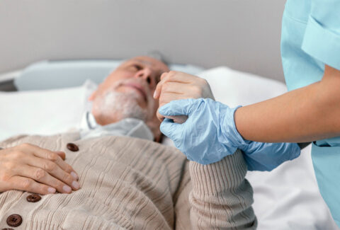 Elderly man receiving compassionate care at home