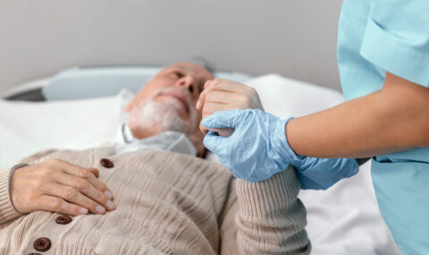 Elderly man receiving compassionate care at home