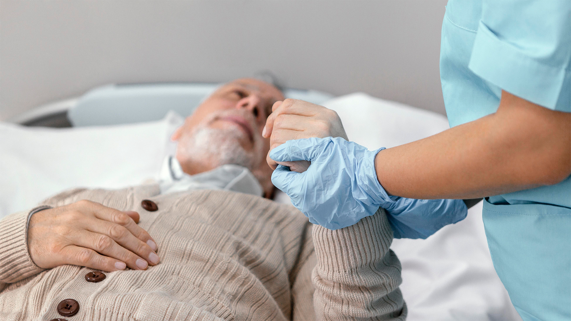 Elderly man receiving compassionate care at home